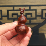 Jadeized thunderstruck jujube wood gourd with cinnabar carving and golden purple plum pendant - Image 4