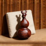 Jadeized thunderstruck jujube wood gourd with cinnabar carving and golden purple plum pendant